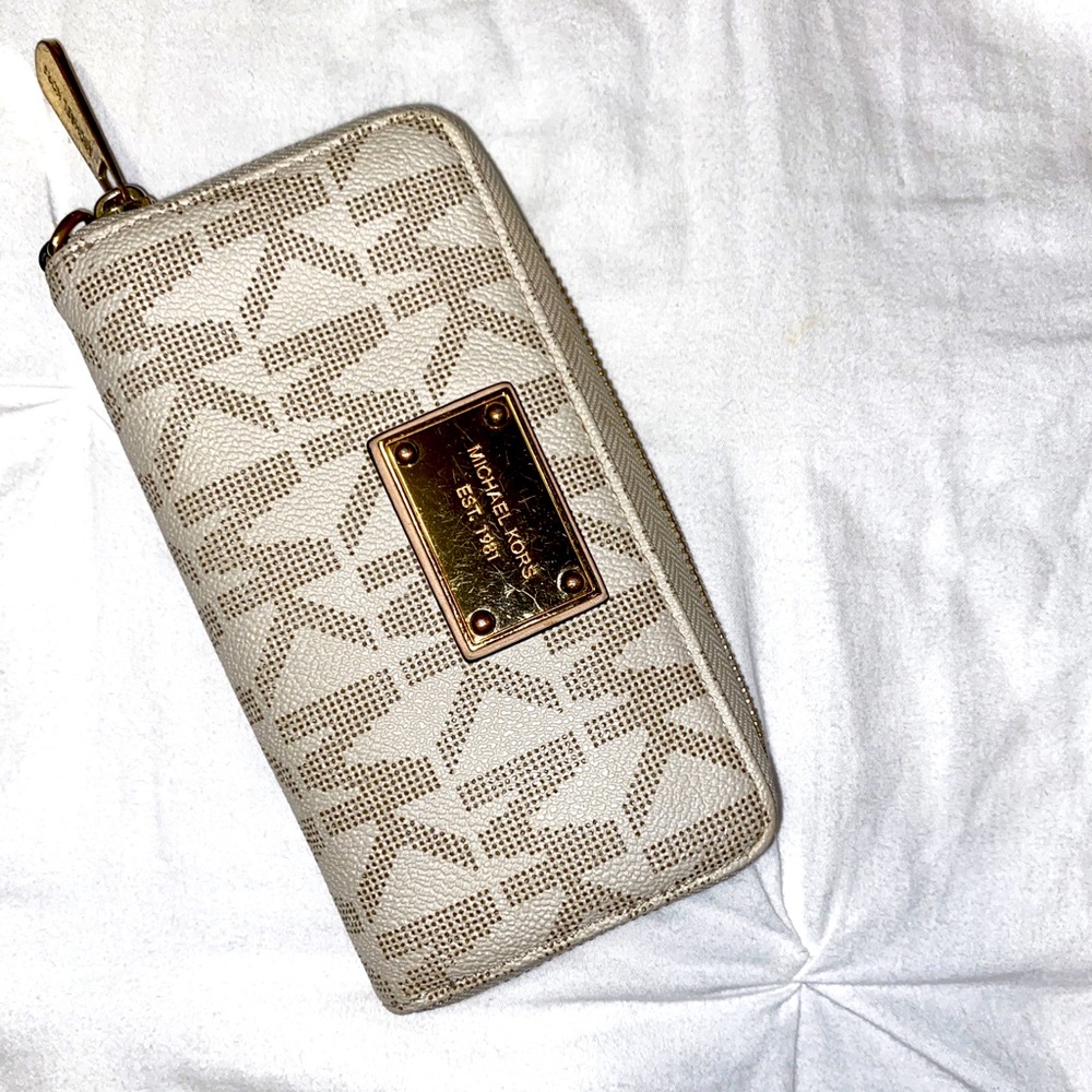 Michael Kors wallet with traditional MK pattern